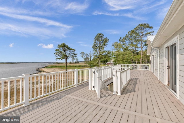 wooden terrace with a water view