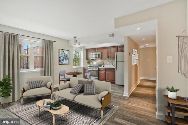 living room with dark hardwood / wood-style flooring