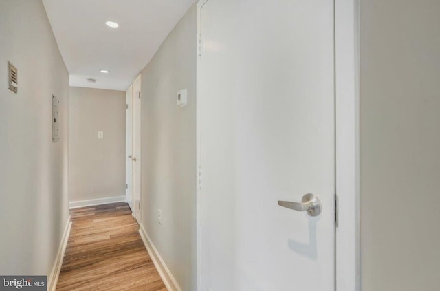 corridor with light wood-type flooring