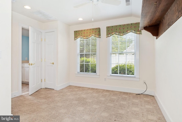 unfurnished room with light carpet and ceiling fan