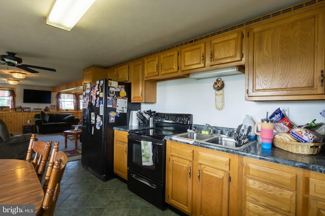 kitchen with ceiling fan and black appliances