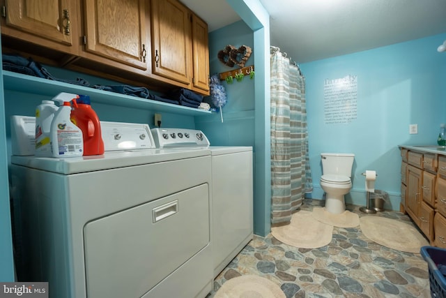 laundry area with washing machine and clothes dryer