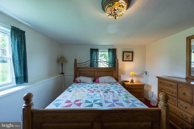 bedroom with multiple windows