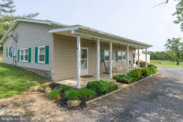 view of side of property with a porch