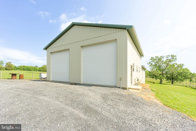 garage with a yard