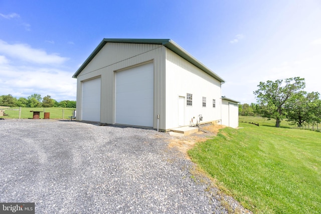 garage featuring a yard