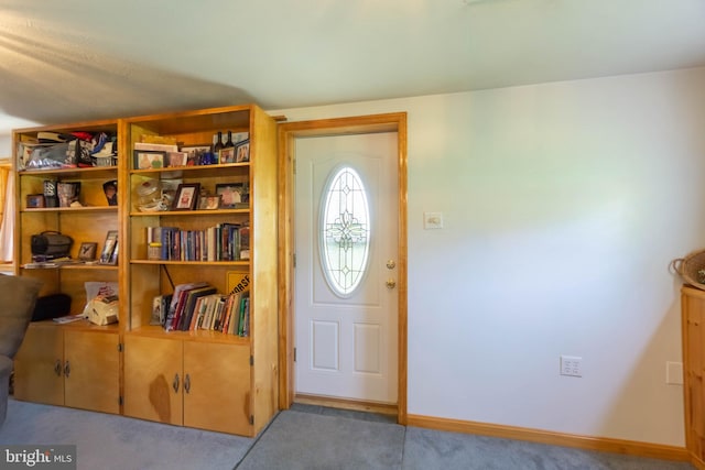 view of carpeted foyer