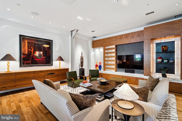 living room with light hardwood / wood-style floors