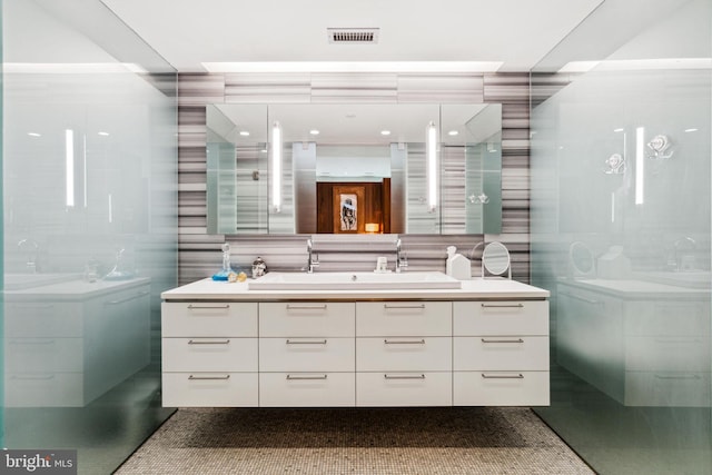 bathroom with tile walls, backsplash, and vanity