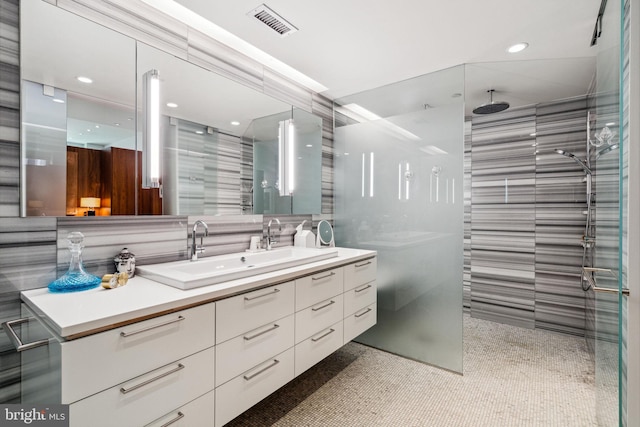 bathroom with vanity and an enclosed shower