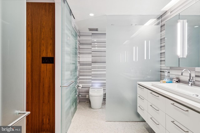 bathroom featuring tile floors, toilet, and vanity