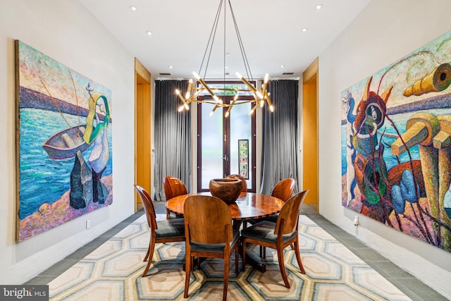 dining room with a notable chandelier and light tile floors