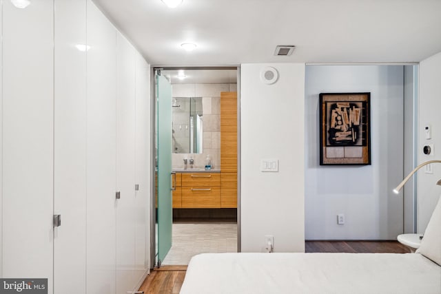 bedroom featuring hardwood / wood-style floors