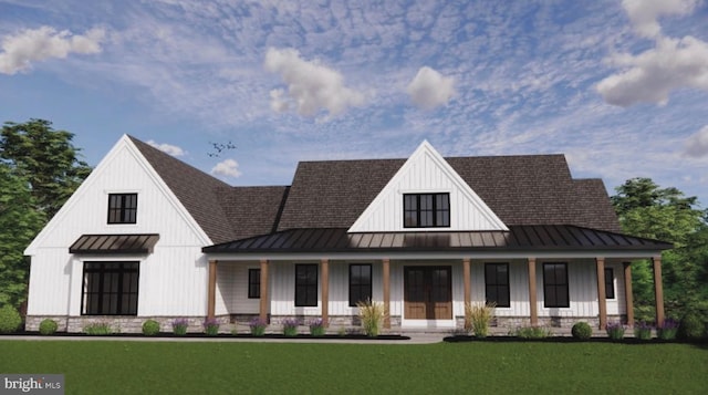 view of front of house with covered porch and a front yard