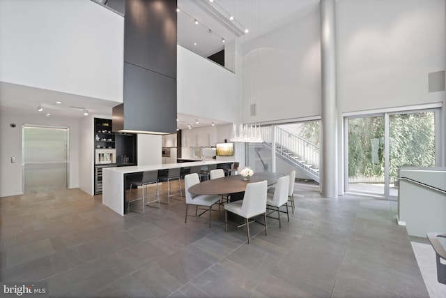 dining area with a high ceiling