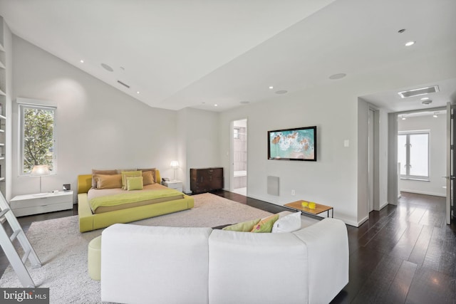 living room with dark wood-type flooring and a healthy amount of sunlight