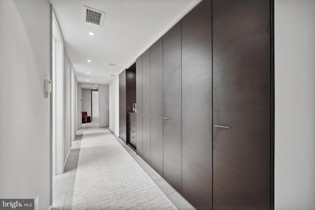 hall with light tile patterned floors