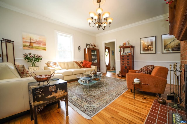 living room with hardwood / wood-style floors, a chandelier, and crown molding