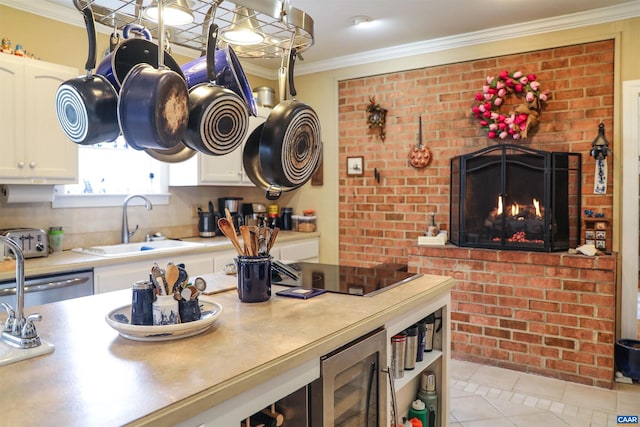 kitchen with white cabinets, crown molding, light tile floors, black electric cooktop, and a fireplace