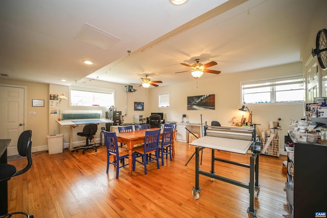 dining space with plenty of natural light, ceiling fan, and light hardwood / wood-style flooring