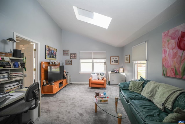 living room featuring light carpet and lofted ceiling with skylight