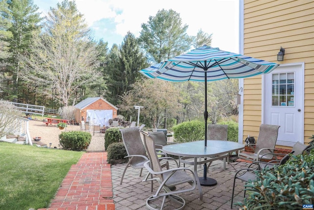 view of patio / terrace with a storage unit