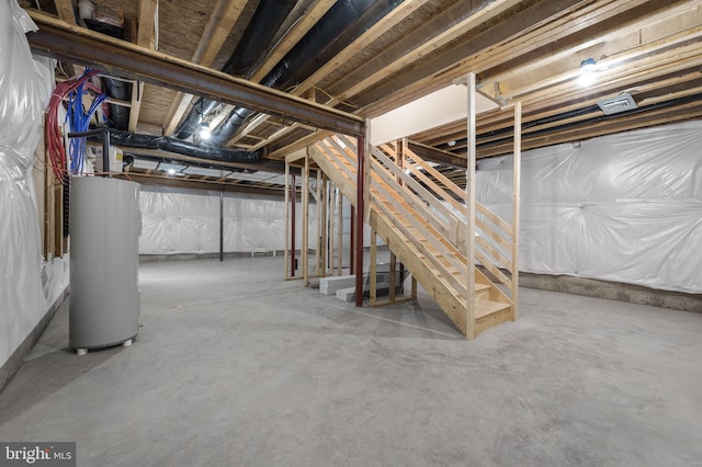 unfinished basement with gas water heater