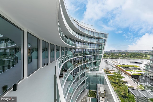 balcony featuring a water view