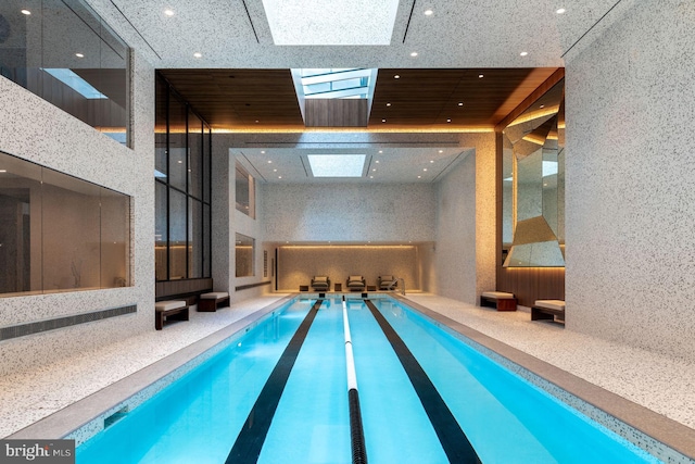 view of swimming pool with a skylight