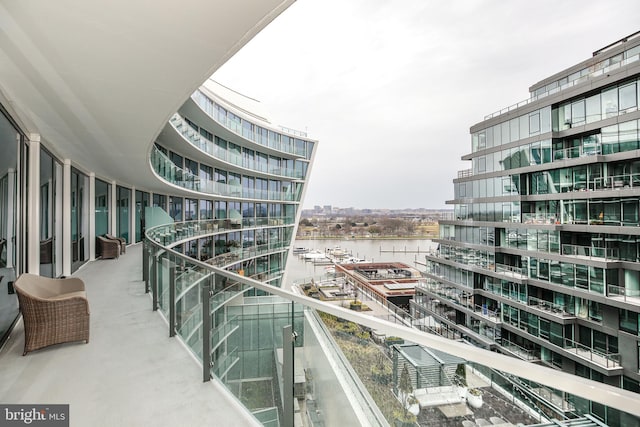 balcony featuring a water view