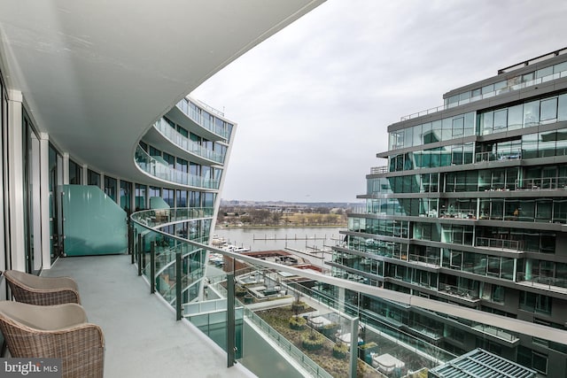 balcony featuring a water view