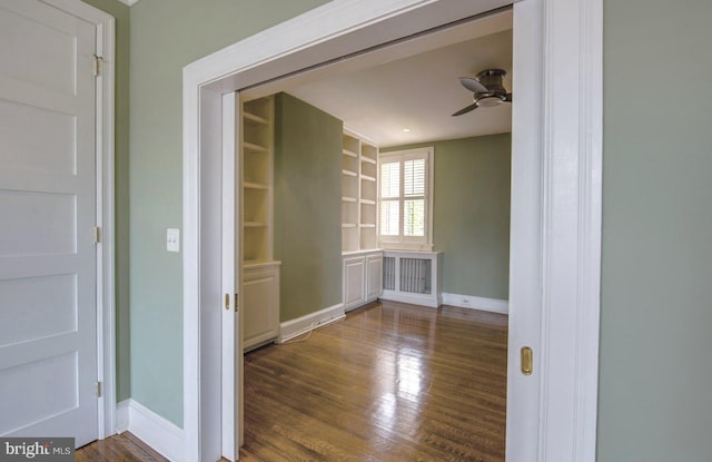 spare room with ceiling fan and dark hardwood / wood-style flooring