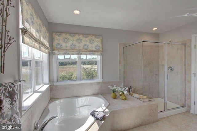 bathroom featuring independent shower and bath and tile floors