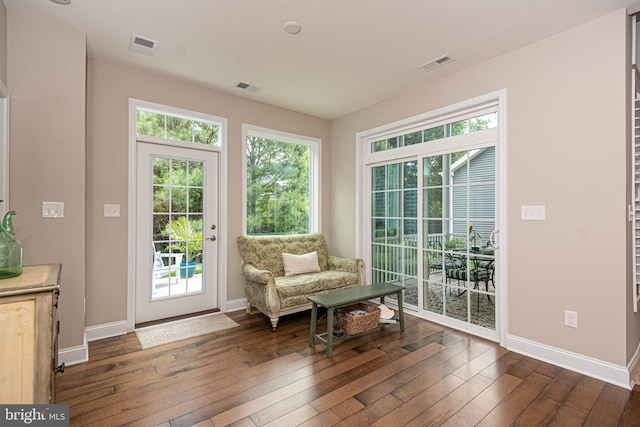 sitting room featuring dark hardwood / wood-style floors