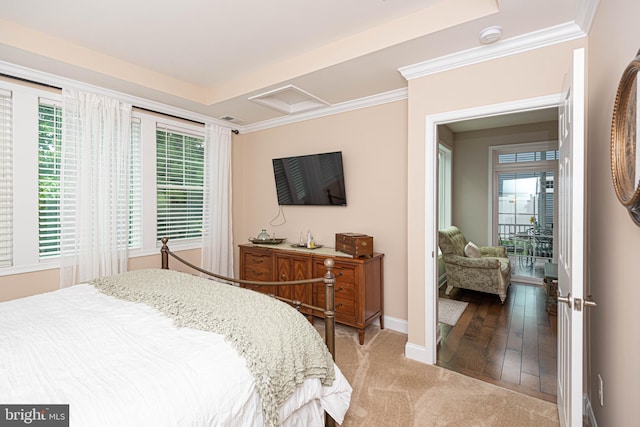 bedroom featuring light wood-type flooring and crown molding