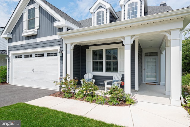 view of front facade with a garage and covered porch