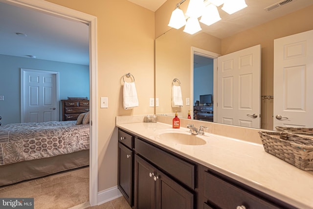 bathroom featuring a skylight and vanity