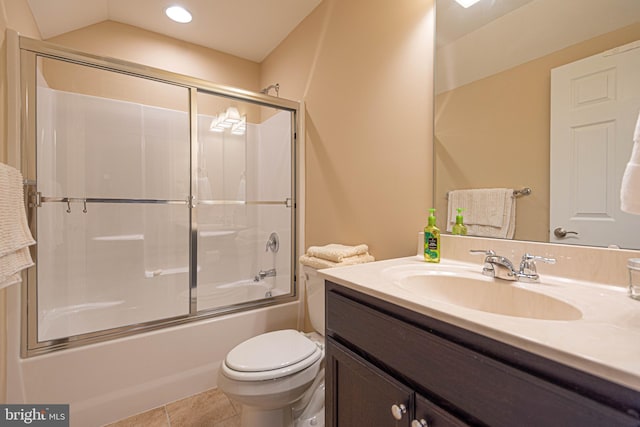 full bathroom featuring lofted ceiling, tile patterned floors, vanity, enclosed tub / shower combo, and toilet