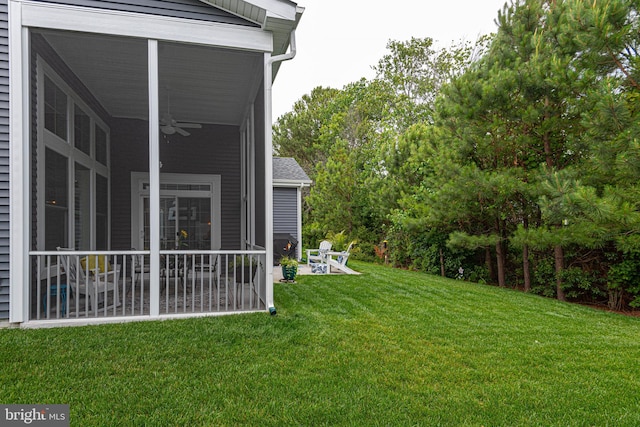 view of yard with ceiling fan