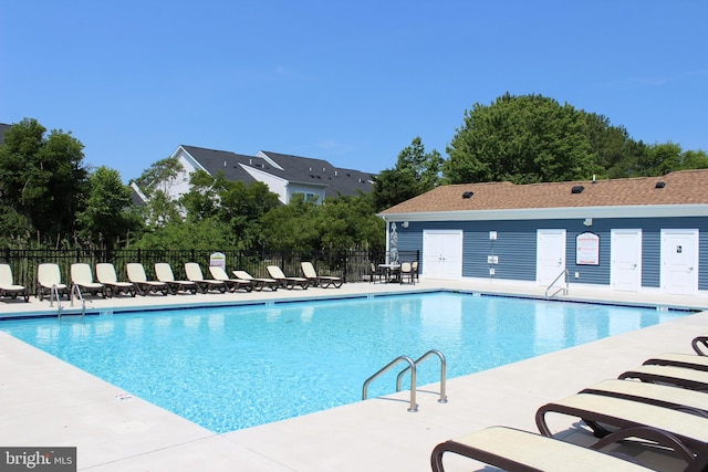 view of swimming pool with a patio