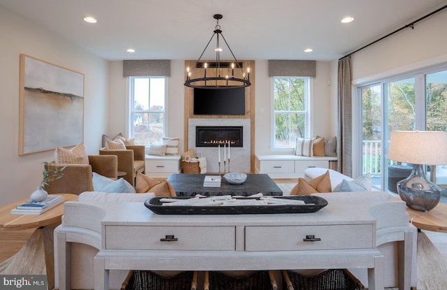 living room with a healthy amount of sunlight and an inviting chandelier