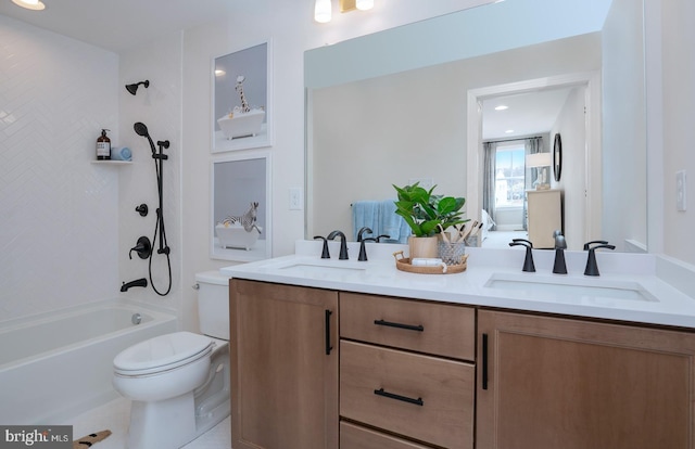 full bathroom featuring tiled shower / bath, tile patterned flooring, vanity, and toilet