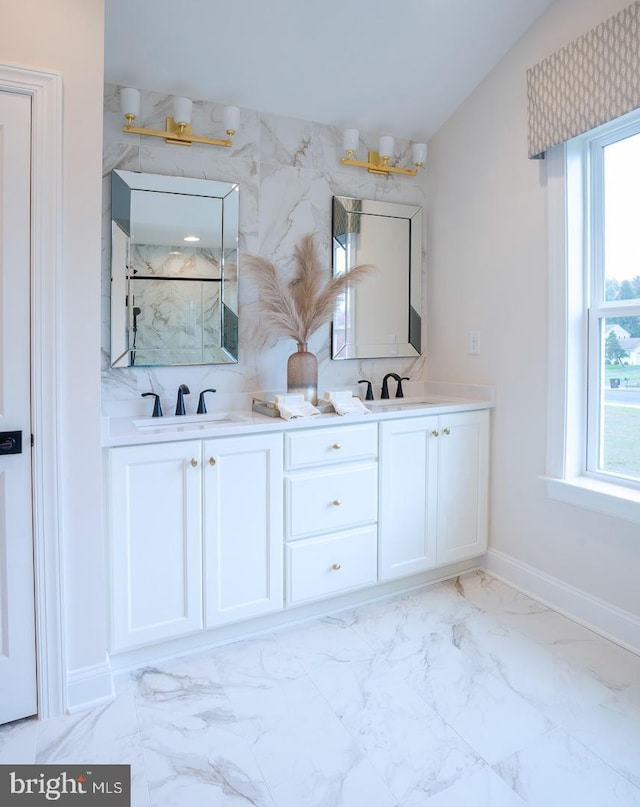 bathroom with a shower and vanity