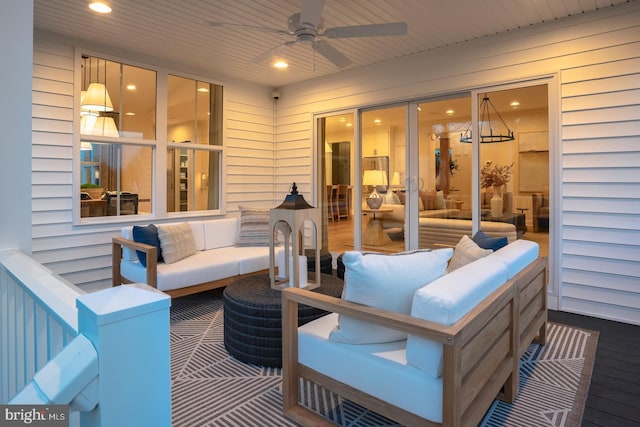 view of patio with an outdoor living space and ceiling fan