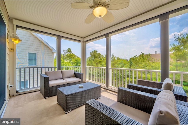 sunroom featuring ceiling fan and a wealth of natural light