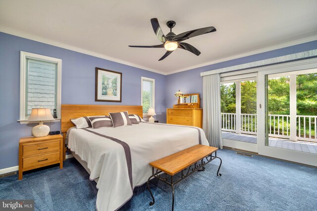 bedroom featuring multiple windows, ornamental molding, dark carpet, and access to exterior