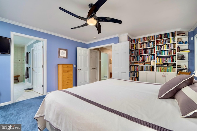 carpeted bedroom featuring ceiling fan, crown molding, and connected bathroom