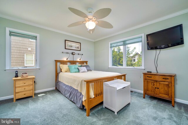 bedroom featuring ceiling fan, carpet floors, and ornamental molding