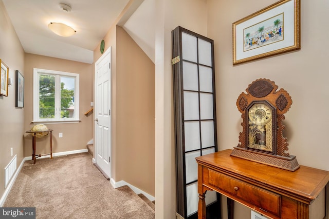 corridor with light colored carpet