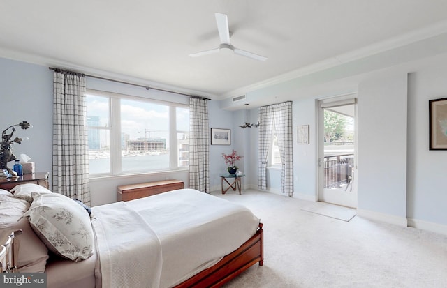 carpeted bedroom with ceiling fan, multiple windows, crown molding, and access to exterior